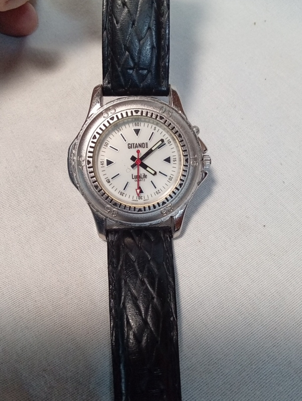 Gitano Lumalite. Silver Case Watch with White Dial and Black Leather Strap
